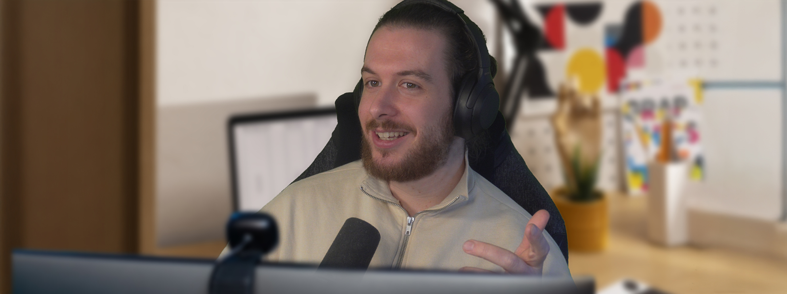 A picture of Max Covey on a video call with a Graphic Design Client